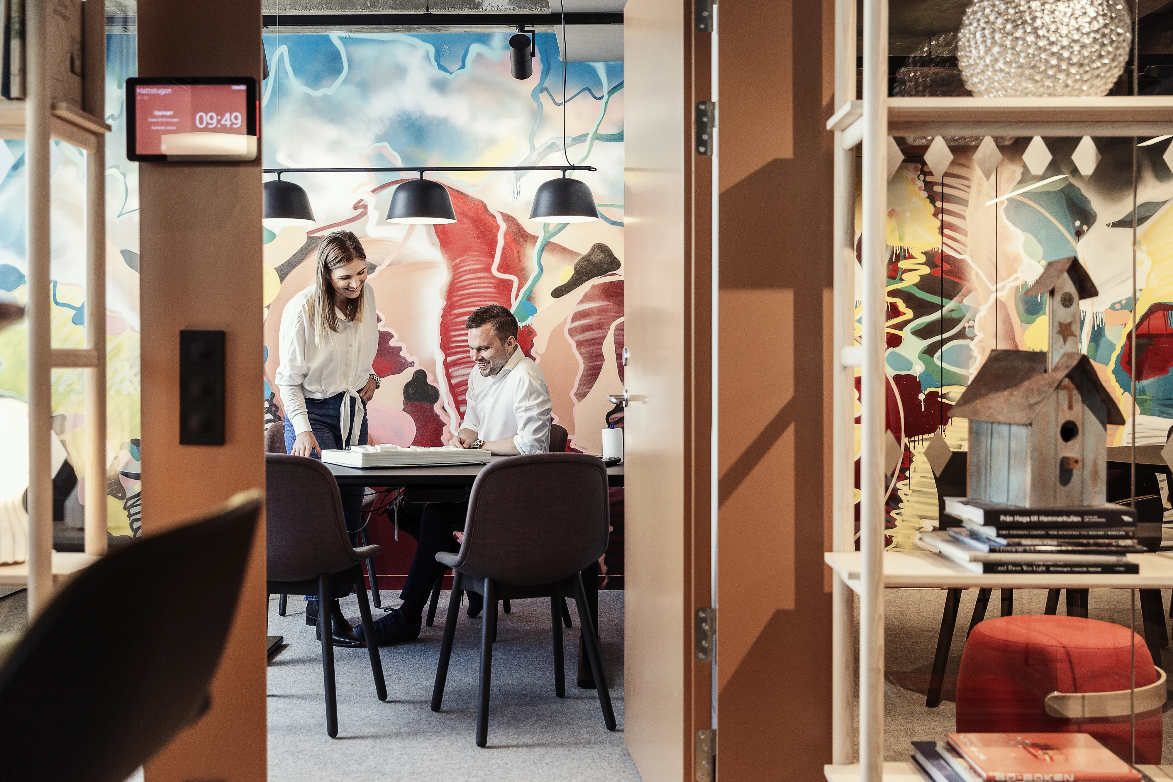 Man and woman in a colorful office