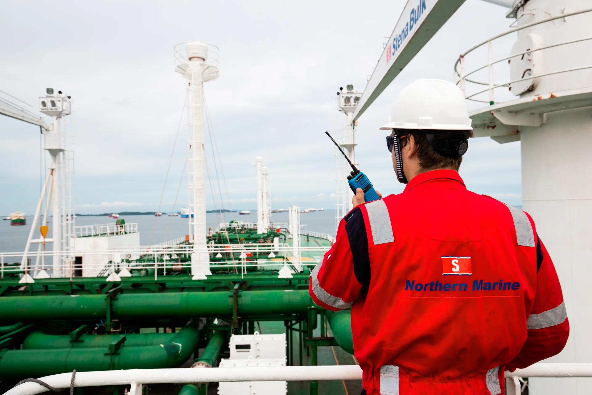 Northern Marine staff on deck holding a radio