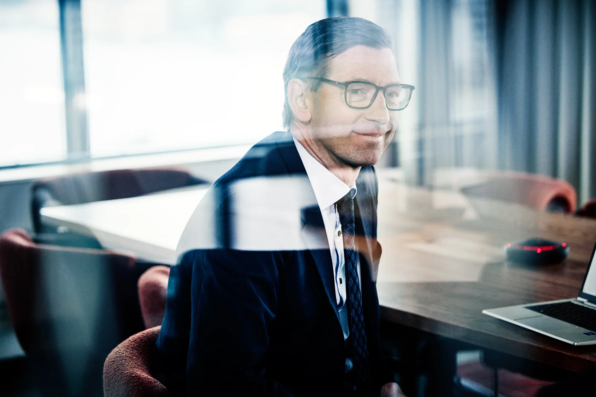 Man sitting at a table in a conference room