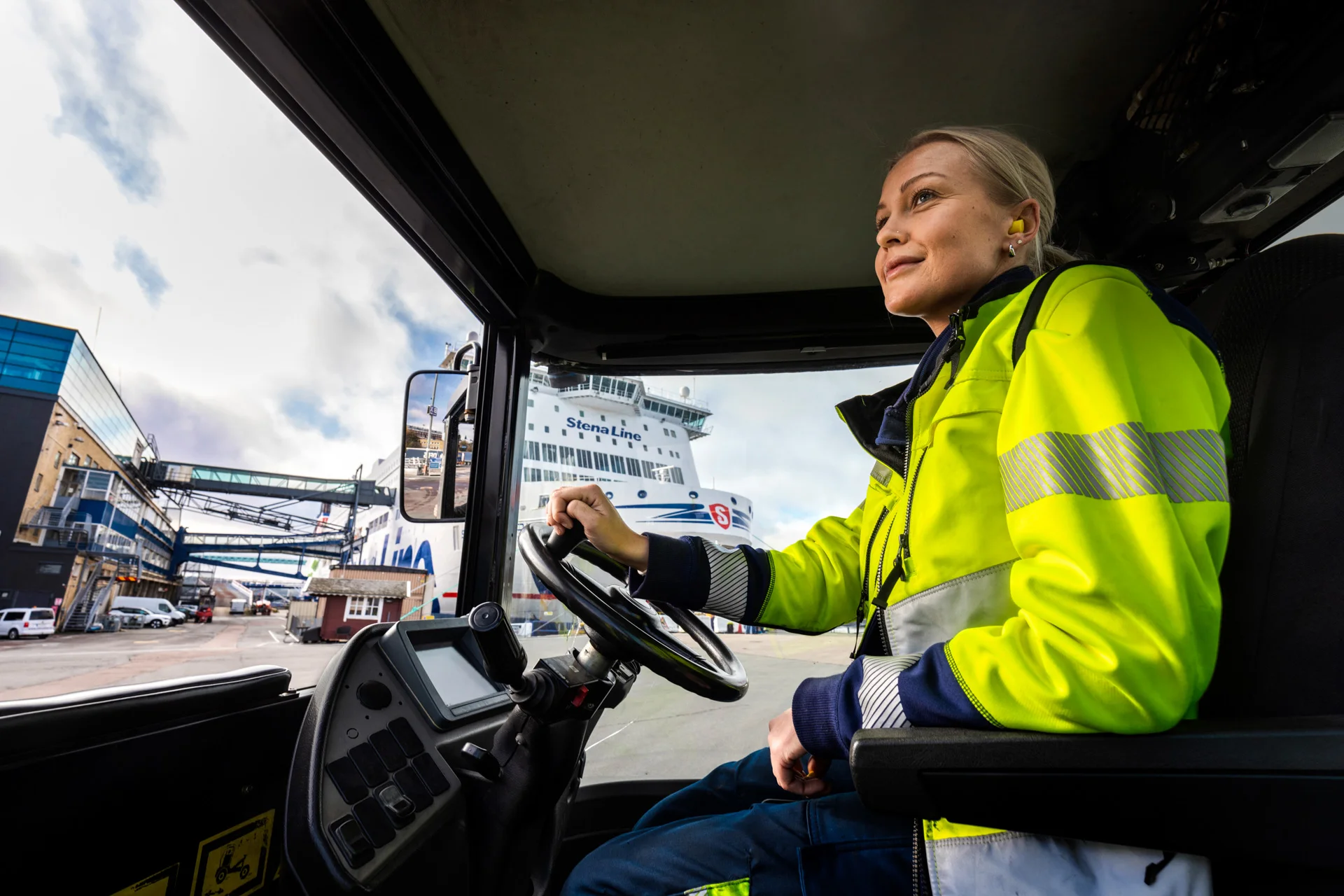 Woman driving a truck at the docks